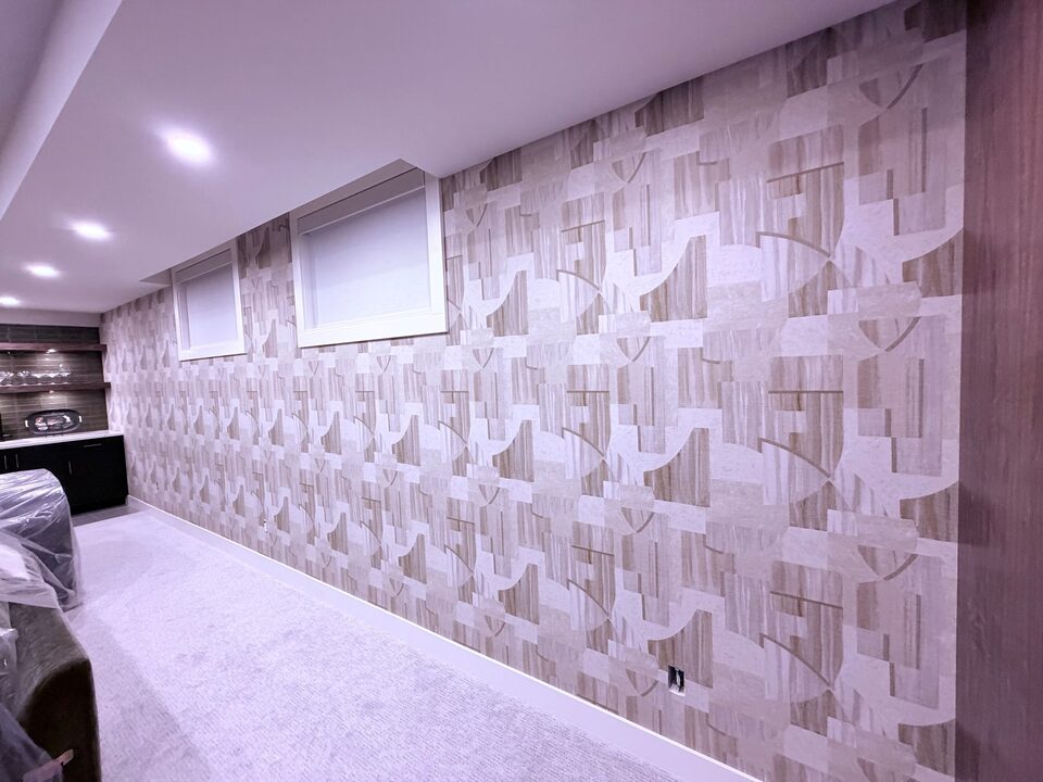JF Fabrics Avalon 8253-33 art deco geometric wallpaper on a 27-foot basement wall from the windows to the wet bar in Altadore, SW Calgary