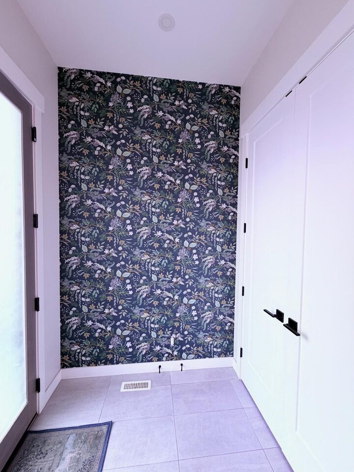 Altadore, Calgary front entry with the Juniper Forest botanical accent wall at the end of the tiled hall