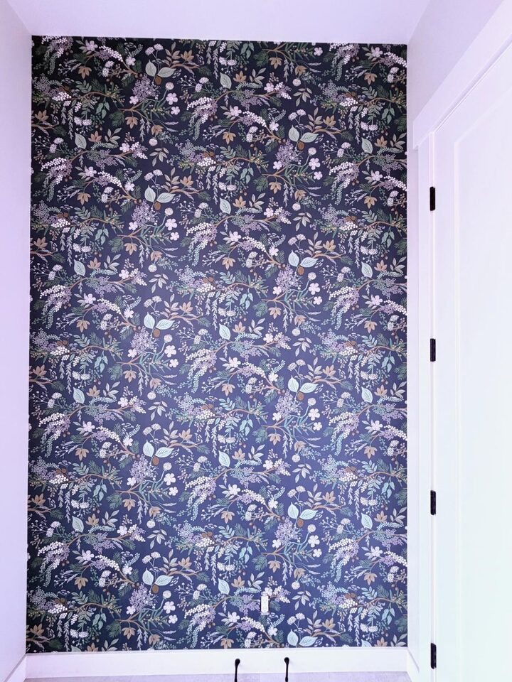 Rifle Paper Co Juniper Forest wallpaper in Pine on a 6 by 10 ft entry accent wall in Altadore, Calgary