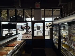 Commercial solar-control window film installed on the entry glazing at North Sea Fish Market Crowfoot in NW Calgary. See the storefront proj