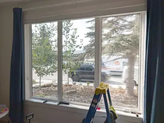 Dual-reflective DR 37 window film installed on street-facing living room windows and mudroom door glass in Bowness, NW Calgary. See the proj