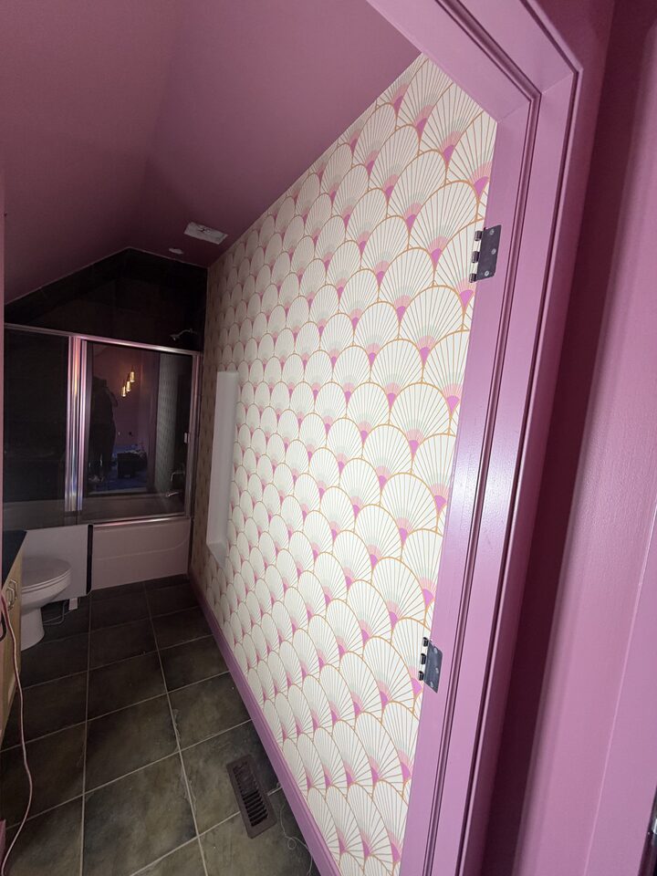 Art deco fan pattern wallpaper on a Canmore bathroom ceiling above a shower