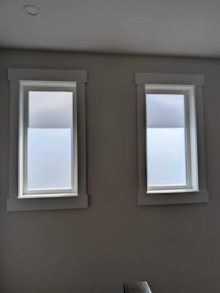 Dining room windows after frosted privacy window film installation in Capitol Hill NW Calgary