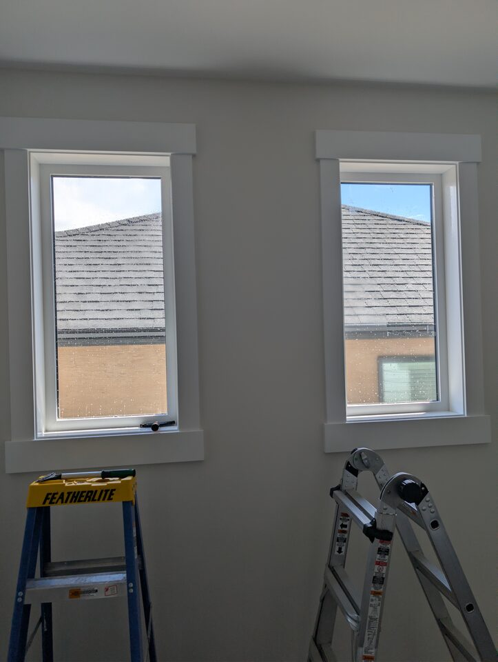 Dining room windows before privacy window film with direct sightline from neighbouring house in Capitol Hill Calgary
