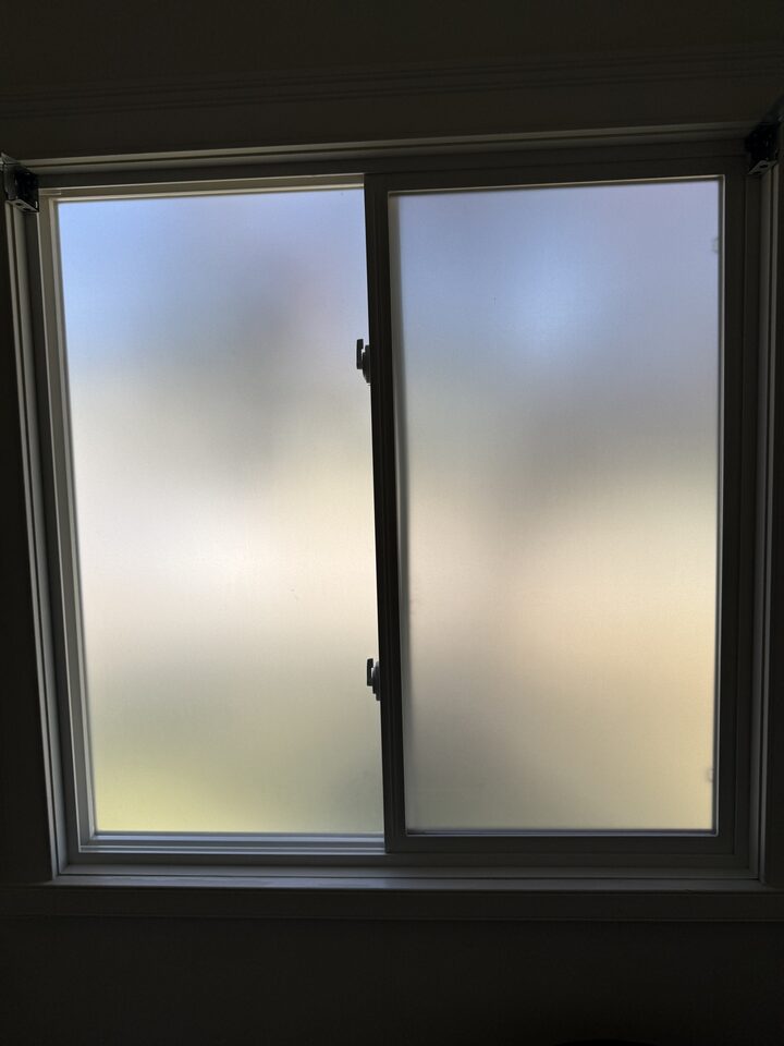 Dusted Crystal frosted privacy film on a street-facing bathroom window in a Collingwood Calgary home