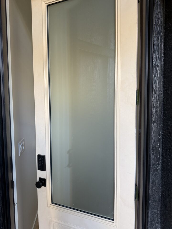 Silver Tech frosted privacy film on front door glass in Collingwood, NW Calgary, seen from the front step
