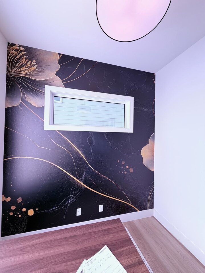 Black marble and gold floral mural cropped around a horizontal window in a Crestmont, Calgary home office