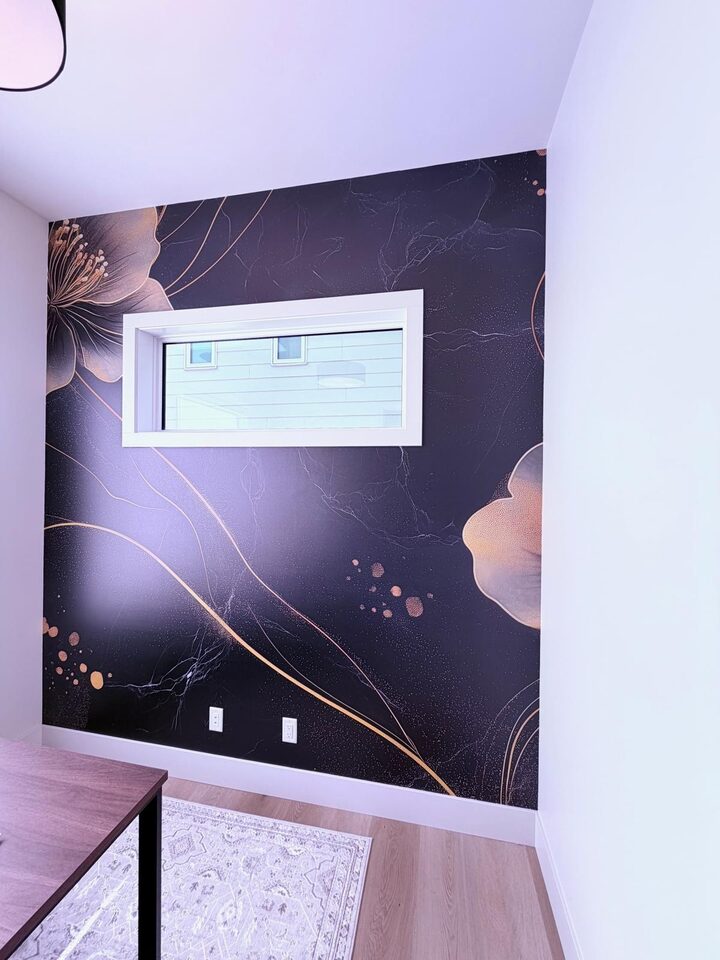 Angled view of the gold flower and gold vein detail in the black floral mural wall in a Crestmont, Calgary home office