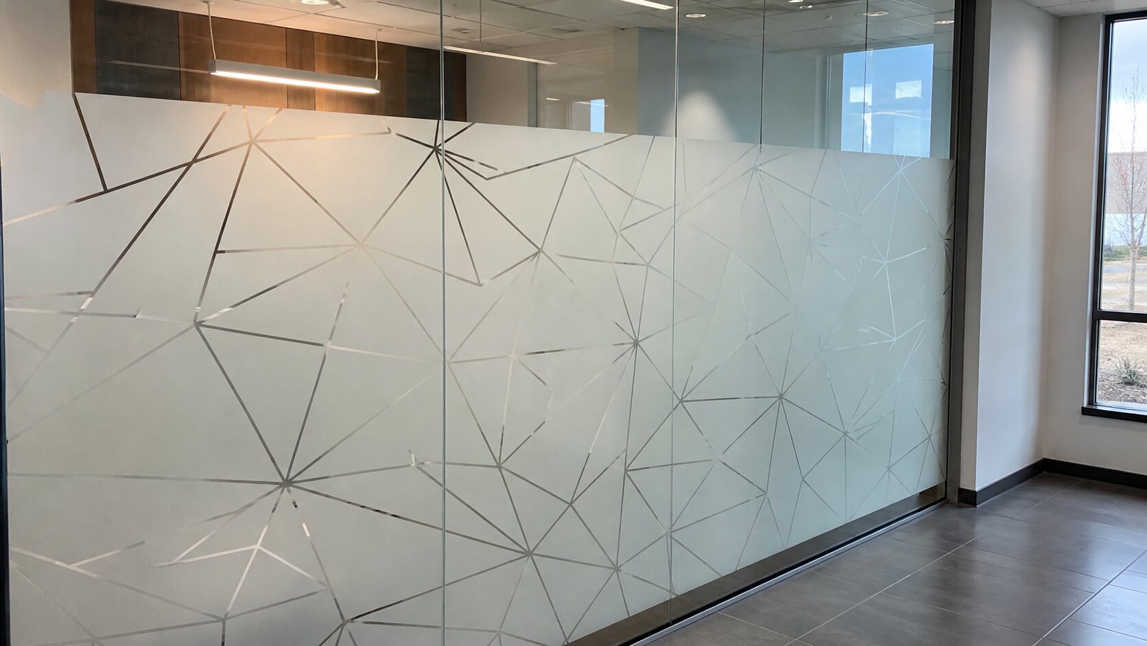 Decorative privacy film on office glass