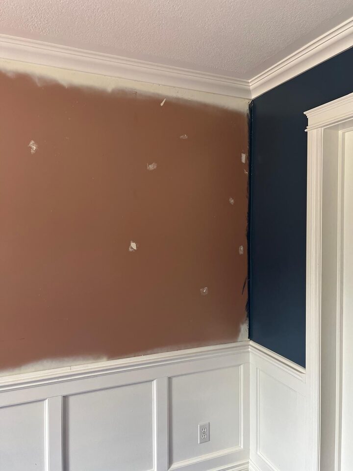 Progress photo of corner wall prep after wallpaper removal in a Deer Run SE Calgary dining room