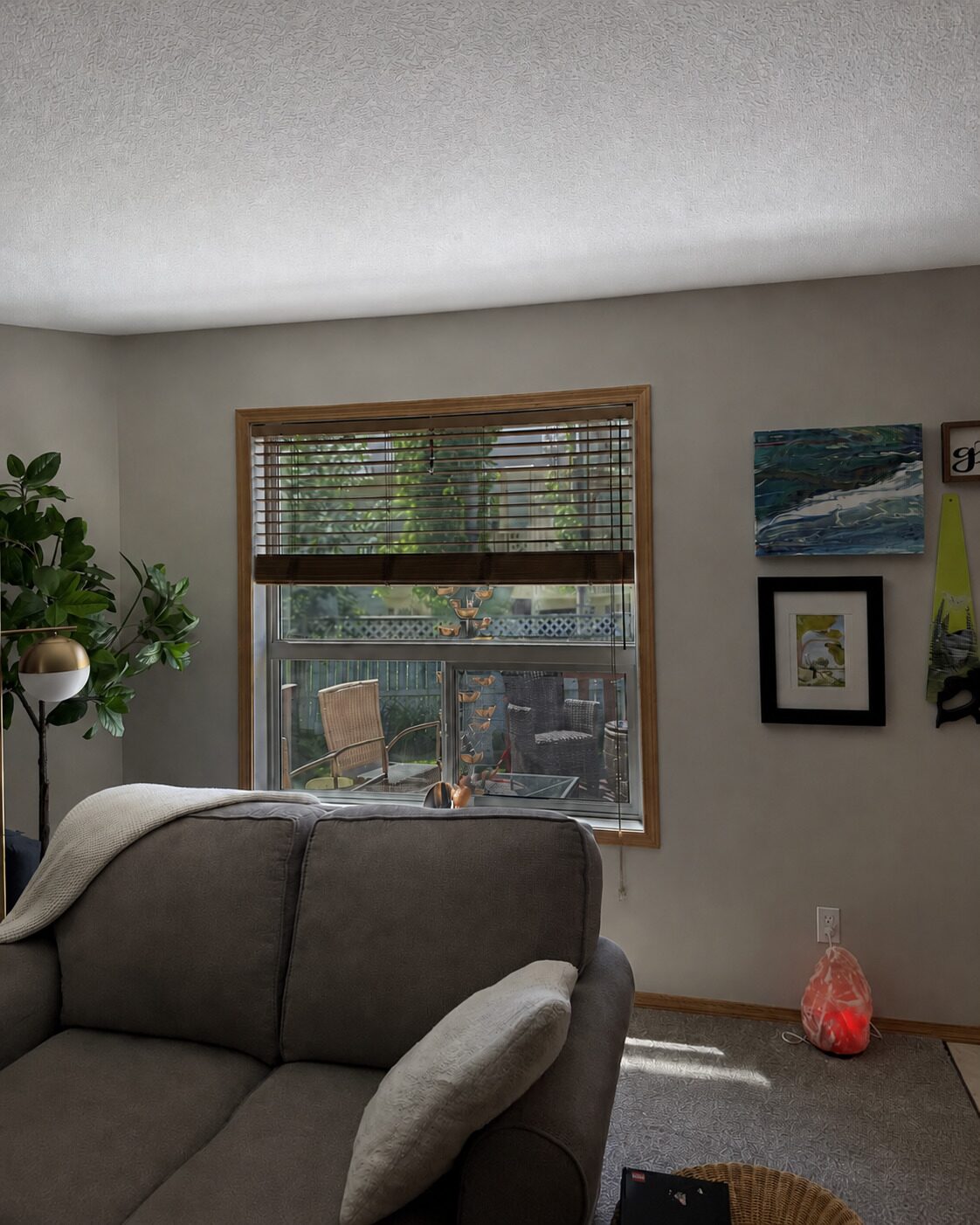 Living room window with new clear solar control film after replacement in Douglasdale SE Calgary