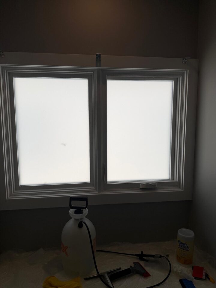 Crystal Etch frosted privacy window film installed on both panes of a double casement window in Elbow Park SW Calgary