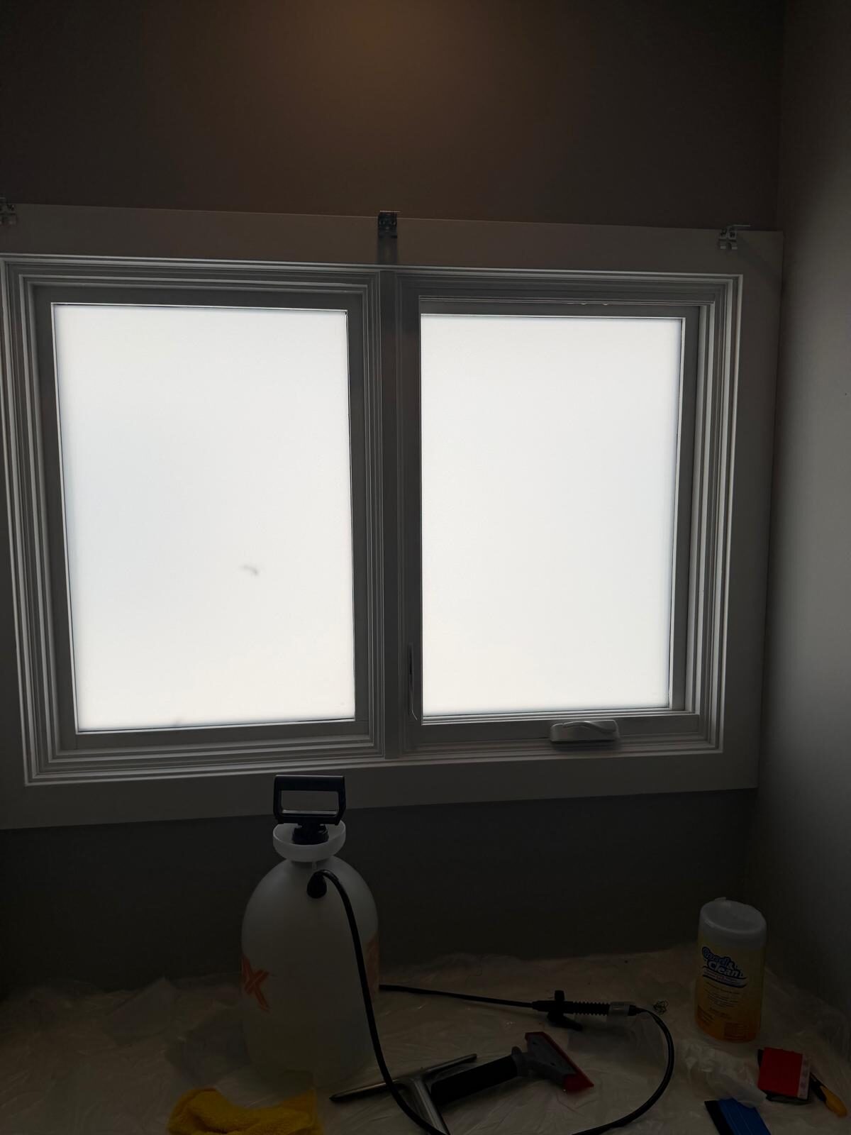 Crystal Etch frosted privacy window film installed on both panes of a double casement window in Elbow Park SW Calgary