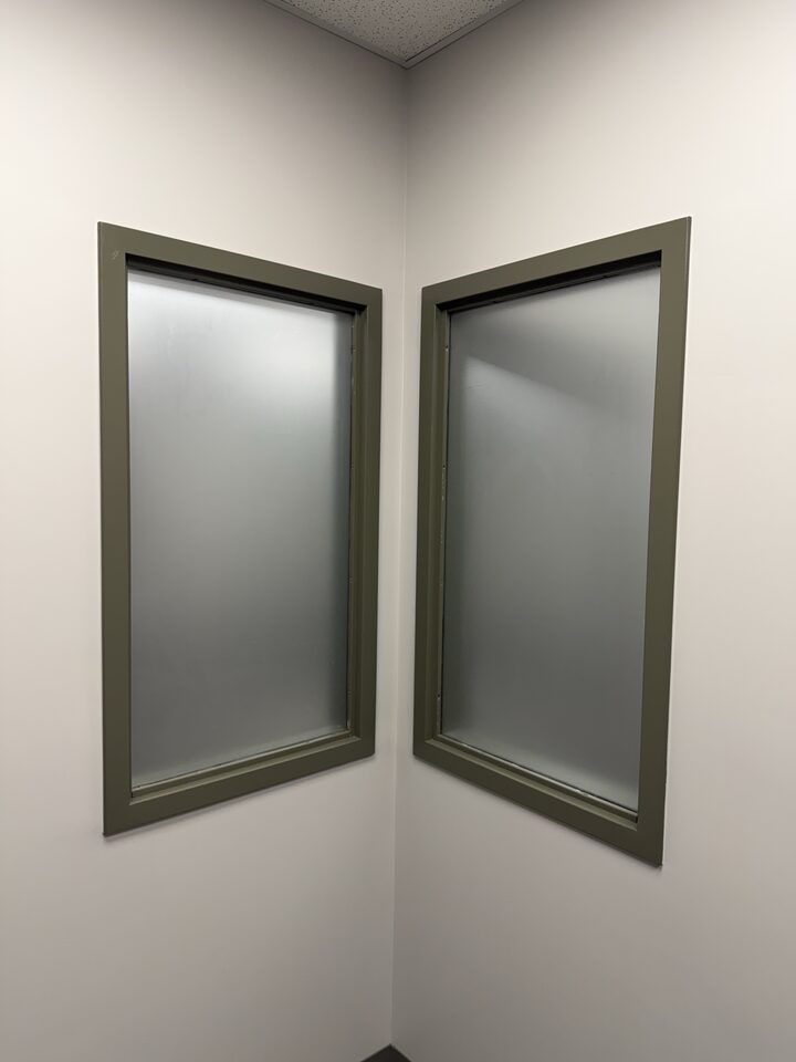 Two interior office windows meeting at a corner, frosted in dusted crystal privacy film, Great Plains, SE Calgary