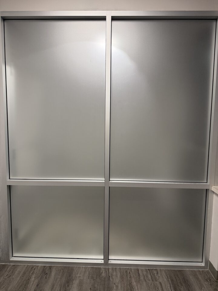 Office glass wall in Great Plains, SE Calgary, with all four panes frosted in dusted crystal privacy film
