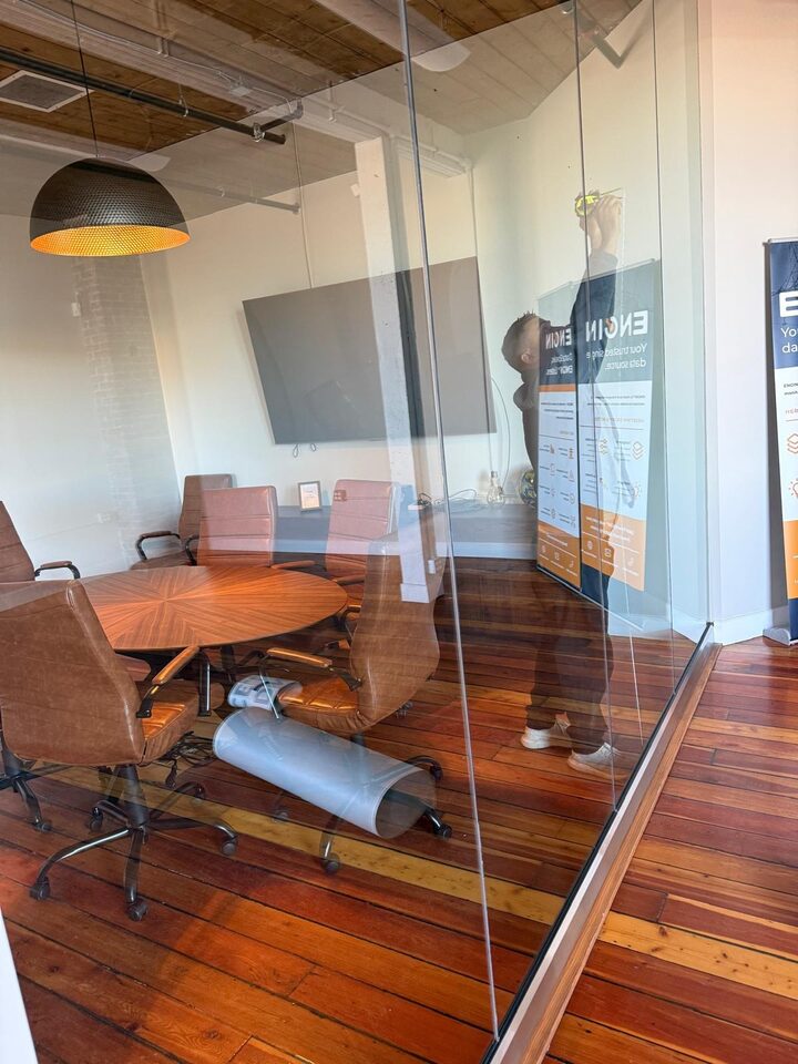 Before context photo of clear office meeting room glass before branded frosted privacy film in Inglewood Calgary