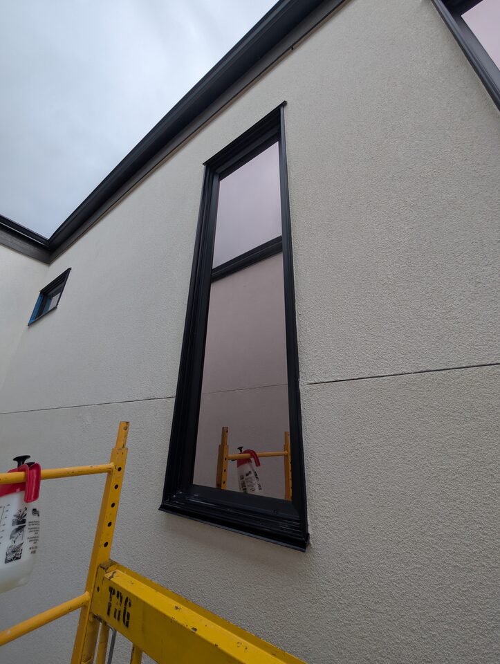 Scaffold access detail for Solar Bronze 20 film on a high exterior window in Rosscarrock SW Calgary