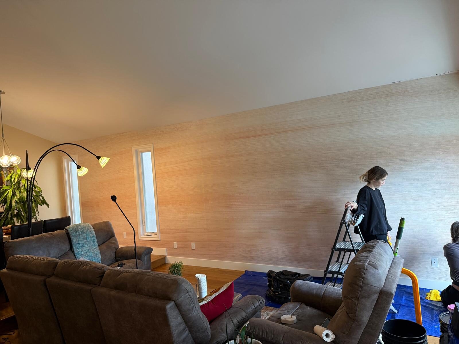 Light Happywall mural wallpaper installed on a long living room feature wall in Sundance SE Calgary