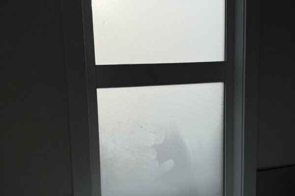 Privacy and solar window film installed on large residential windows in a Calgary home