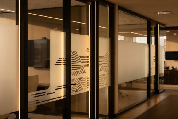 Frosted decorative window film on a Calgary office glass partition